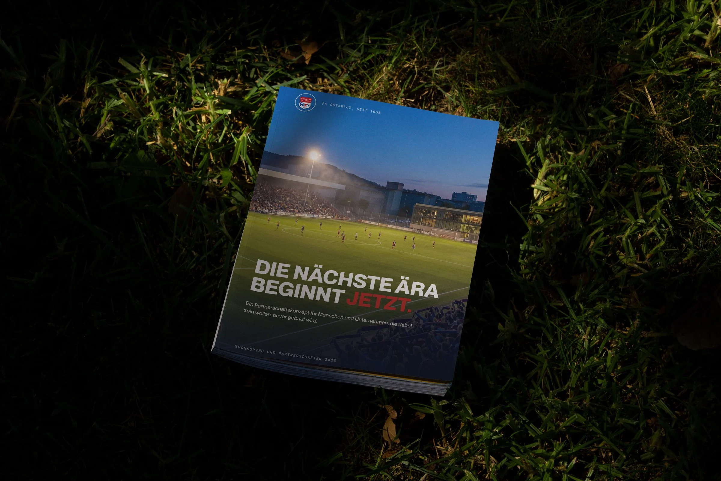 The FC Rotkreuz sponsoring dossier on grass at night, cover with a floodlit stadium photograph and the headline Die naechste Aera beginnt jetzt