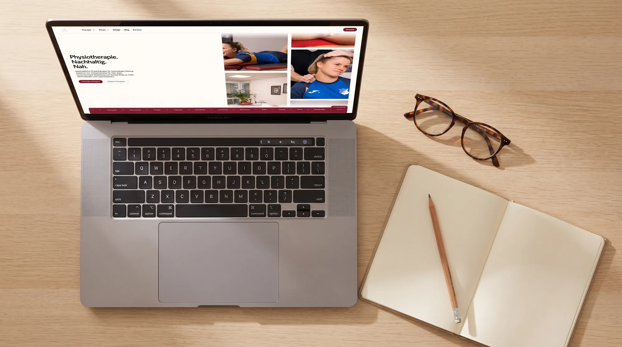 Die Physion-Startseite auf einem MacBook Pro, von oben fotografiert