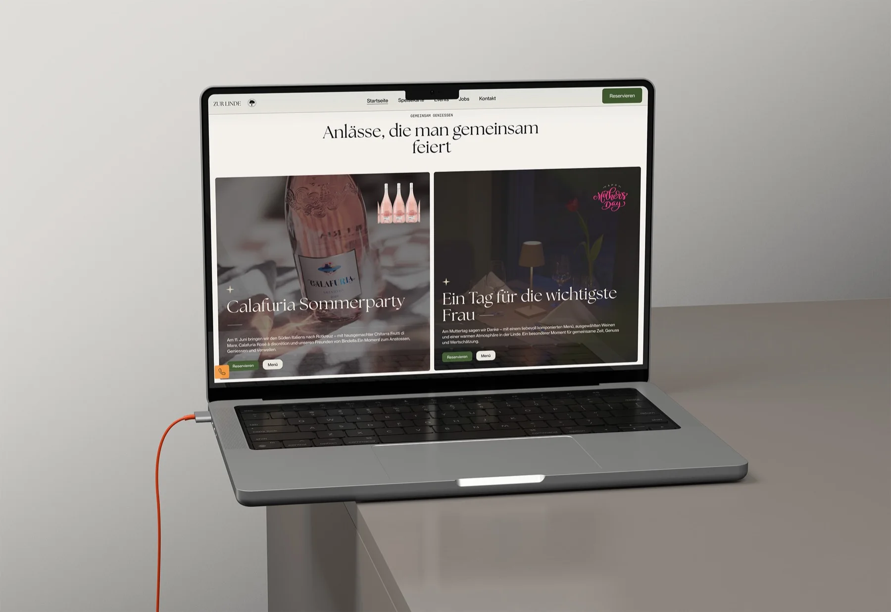 A laptop on a pale surface showing the Zur Linde events page, headline Anlaesse, die man gemeinsam feiert
